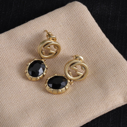 Bon bracelet, boucles d'oreilles et collier au design sophistiqué (noir)