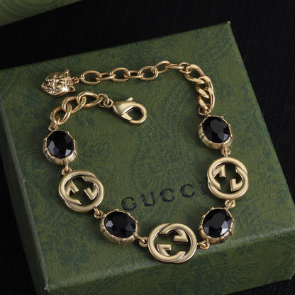 Bon bracelet, boucles d'oreilles et collier au design sophistiqué (noir)