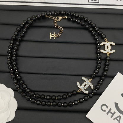 Schwarze Art-déco-Mädchen-Pulloverkette