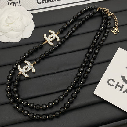 Schwarze Art-déco-Mädchen-Pulloverkette
