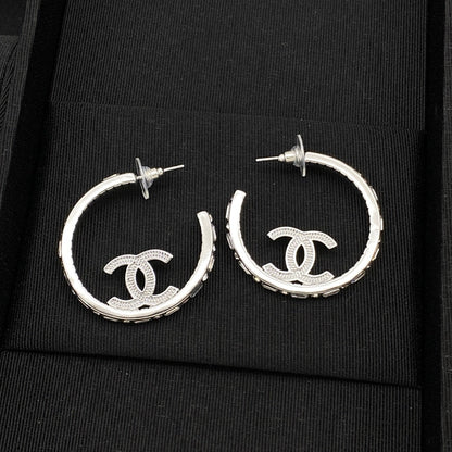 Jolies boucles d'oreilles créoles argentées CC